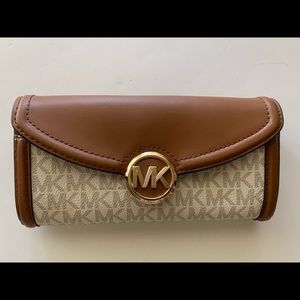 Michael Kors - snap and zipper closure wallet.